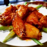 10 Jumbo Chicken Wings · Served with blue cheese and celery, Buffalo, BBQ or garlic sauce.