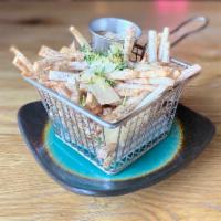 Truffle Taro Fries · French fried taro tossed with truffle salt, parmesan, and fresh thyme. Served with Truffle R...
