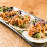 Crunchy Fish Tacos (3 Tacos) · Wild cod crusted in panko and fried to a delicate crunch served on a bed of Thai Slaw with A...
