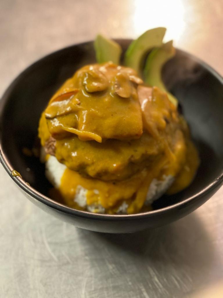 Loco Moco · Your choice of 8oz burger, Chicken Katsu, or Kalua Pork, topped with a sunny side egg, spam, avocado, mushroom gravy over rice.

*(Make it vegan with a beyond burger and fried tofu instead of egg +$3)