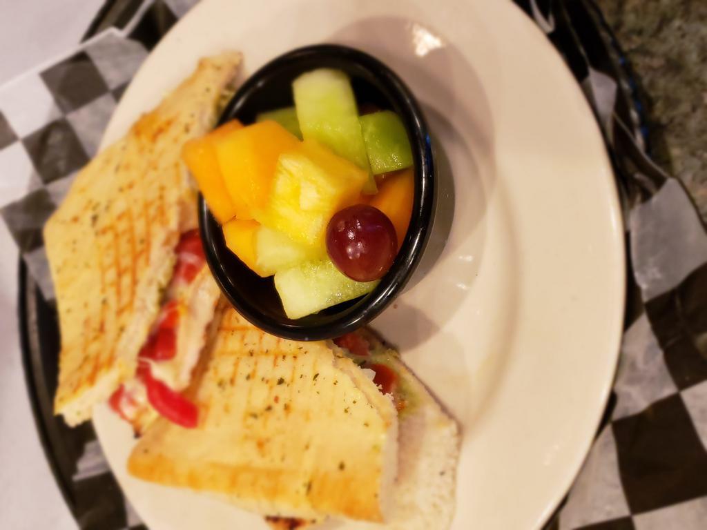 Chicken Pesto Panini Lunch · Grilled chicken, roasted red peppers, tomato, melted provolone and pesto mayonnaise. Served with chips, pasta salad or fruit cup.