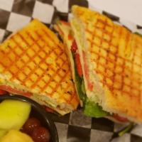Vegetarian Panini Lunch · Spinach, tomato, roasted red peppers, melted provolone and pesto mayonnaise. Served with chi...