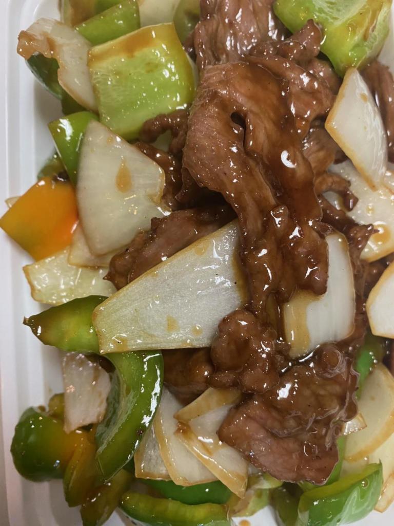 51. Pepper Steak with Onion · Stir fried steak with vegetables and a savory sauce.