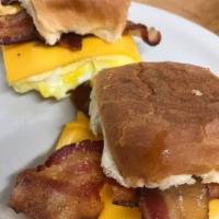 Bacon Egg and Cheese sandwich · Served with 2 fresh eggs, melted cheese and bacon