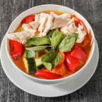 Chicken red curry 24oz · Spicy curry with chicken, bell pepper, carrots, zukini and bassil. Served with steam rice