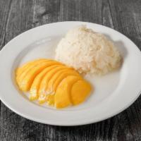 Sticky rice with mango  · Sweet rice with coconut milk tops with mango