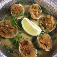 Baked Clams · Baked clams on the 1/2 shell with bread crumbs, lemon, garlic and white wine.