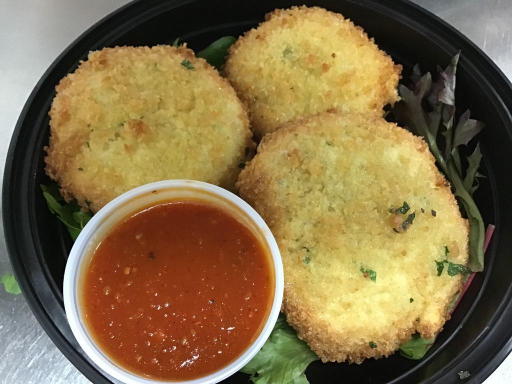 Mozzarella in Carrozza · Mozzarella between 2 slices of white bread parmesan and breadcrumb encrusted pan fried served with marinara sauce.