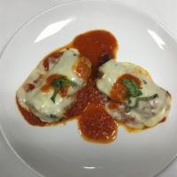 Rollatini di Melanzane · Ricotta and spinach eggplant rolls in a light tomato sauce and Parmesan.