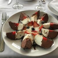 Tartufo · Vanilla and chocolate ice cream with nuts and cherry, coated with chocolate shell.
Note: sho...