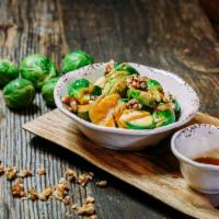 Brussels Sprouts · Sauteed with sesame oil and topped with house made peanut sauce and walnuts.