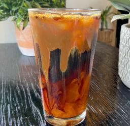 Iced Salted Caramel Cold Brew · Salted caramel flavoring mixed with our house cold brew topped with a salted caramel drizzle. 