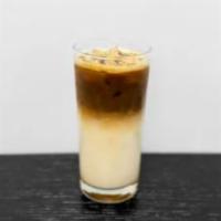 Iced Kribi Macchiato · Vanilla syrup, milk, espresso, with caramel drizzle on top.
