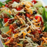 Taco Salad · Romaine lettuce, seasoned ground beef, cheese, tomato, onions, black olives, salsa, sour cre...