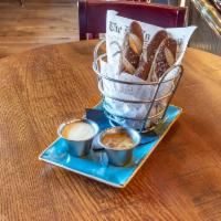 Beer Baked Pretzel Sticks · Warm Bavarian-style pretzels, white cheddar sauce, honey mustard.