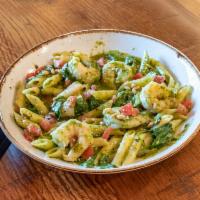 Shrimp & Penne Genovese · Pesto, spinach, fresh tomato, pine nuts, Parmesan.