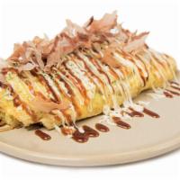 Omu Soba · Yakisoba noodles sautéed with pork and vegetables wrapped in omelette topped with bonito fla...