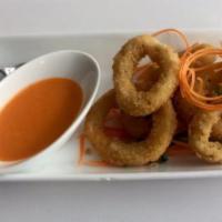 Dinner Crispy Calamari · Served with spicy Sriracha mixed with sweet sauce.