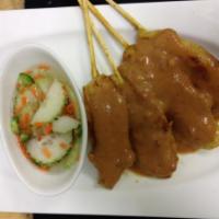 Dinner Satay · Grilled marinated chicken strips in coconut milk and curry, cucumber salad and peanut sauce.
