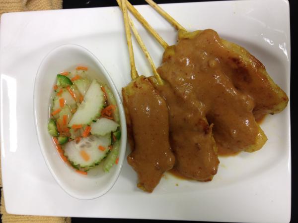 Dinner Satay · Grilled marinated chicken strips in coconut milk and curry, cucumber salad and peanut sauce.