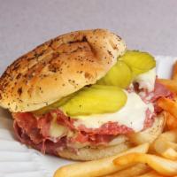 Giant Corned Beef Sandwich · 14 oz. thinly sliced corned beef, pickles, mustard and cheese on an onion roll.