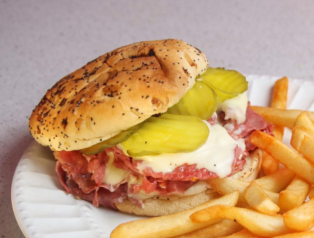 Giant Corned Beef Sandwich · 14 oz. thinly sliced corned beef, pickles, mustard and cheese on an onion roll.