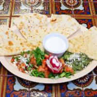Quesadilla · Flour tortillas filled with mixed cheeses, served with pico de gallo, guacamole and sour cre...