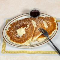 Pancakes · Three hot and delicious buttermilk pancakes served with butter, hot syrup, and sprinkled wit...