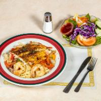 Seafood Maryland Pasta · An entree for the hungry! Shrimp, crabmeat, filet of sole, peppers, mushrooms, and onions ov...