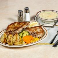 Grecian Pork Chops · Two center cut pork chops rubbed with greek seasoning and broiled in lemon butter sauce. Ser...