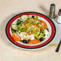 Greek Salad   · A mound of mixed greens with onions, tomatoes, pepperoncini, Kalamata olives, feta cheese, a...