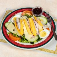 Julienne Salad  · A portfolio of mixed greens topped with tomatoes, sliced turkey, ham, American and Swiss che...