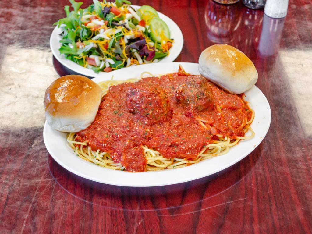 Spaghetti with Meat Sauce · A healthy portion of our pasta comes with a side salad and a fresh roll. Available for 2 meatballs or Sausage an additional charge.
