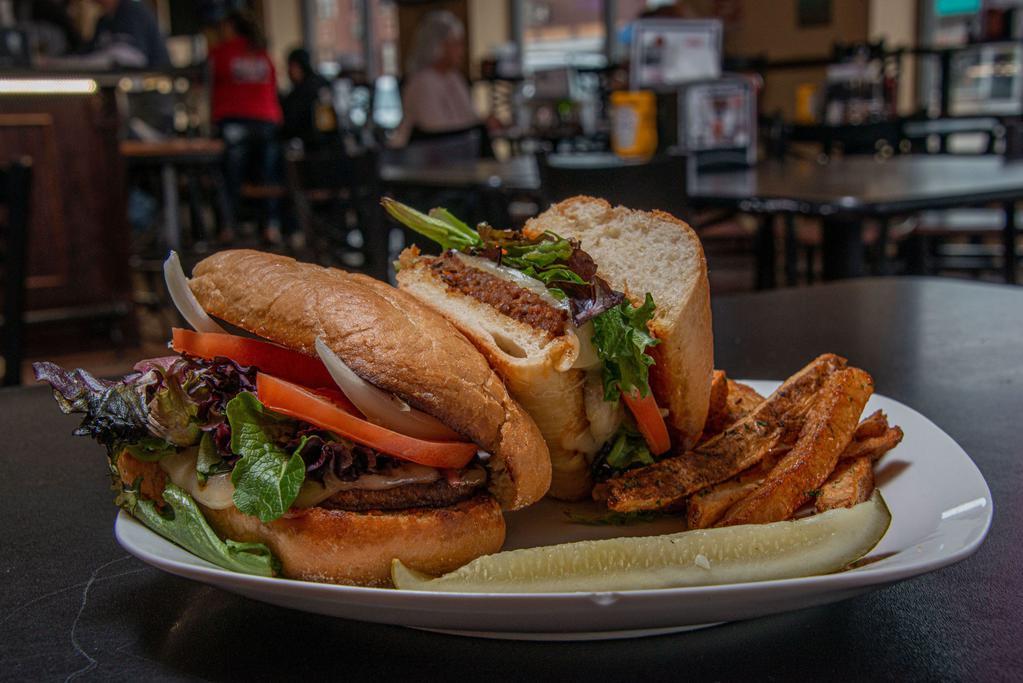 Taproom Ultimate Grinder Sandwiche · Italian sausage, with provolone cheese, mixed greens, tomato, and onion on a hoagie bun.