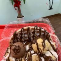 Chocolate Banana Ice Cream Sandwich · Waffle topped with 2 scoops of ice cream, banana, chocolate syrup and whipped cream. 