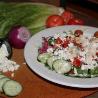 Mediterranean Salad · Romaine and spring mix topped with brick fired chicken, cherry tomatoes, cucumbers, red onio...
