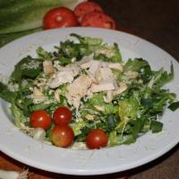 Chicken Cashew Salad · Romaine and spring mix topped with brick fired chicken, cherry tomatoes, green onions, cashe...