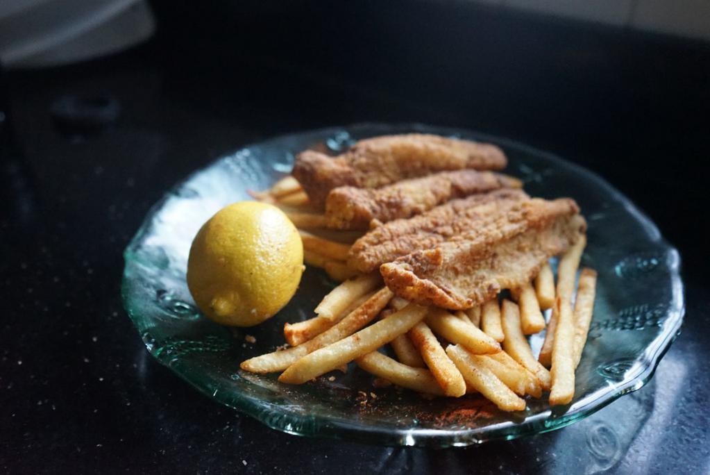 Catfish Basket · 2 Catfish Fillets cut into tenders served on a pile of
french fries.