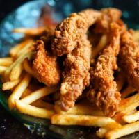 Chicken Strip Basket · Deliciously battered chicken strips served on a bed
of french fries.