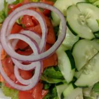 House Salad · Mixed greens, cucumber, red onion, carrots, and tomatoes.