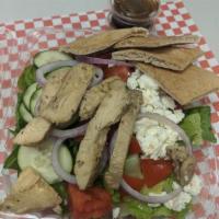 Grilled Chicken Salad · Mixed greens topped with grilled chicken, cucumbers, feta cheese, tomatoes, red onions and b...