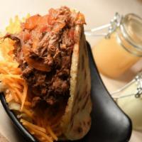 Carne · Shredded beef with creole sauce (guiso) and mixed cheese / Carne desmechada con hogao y ques...