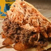 Riko Full · Shredded chicken and beef with creole sauce, sweet plantains, mozzarella and cheddar cheese ...