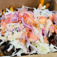 TEKE TEKE FRIES · Seasoned French fries, our magic sauce, ground beef, cabbage, pink sauce , tomatoes, and oni...