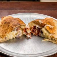 Meat Lovers Calzone · Pepperoni, sausage, and meatball stuffed calzone.