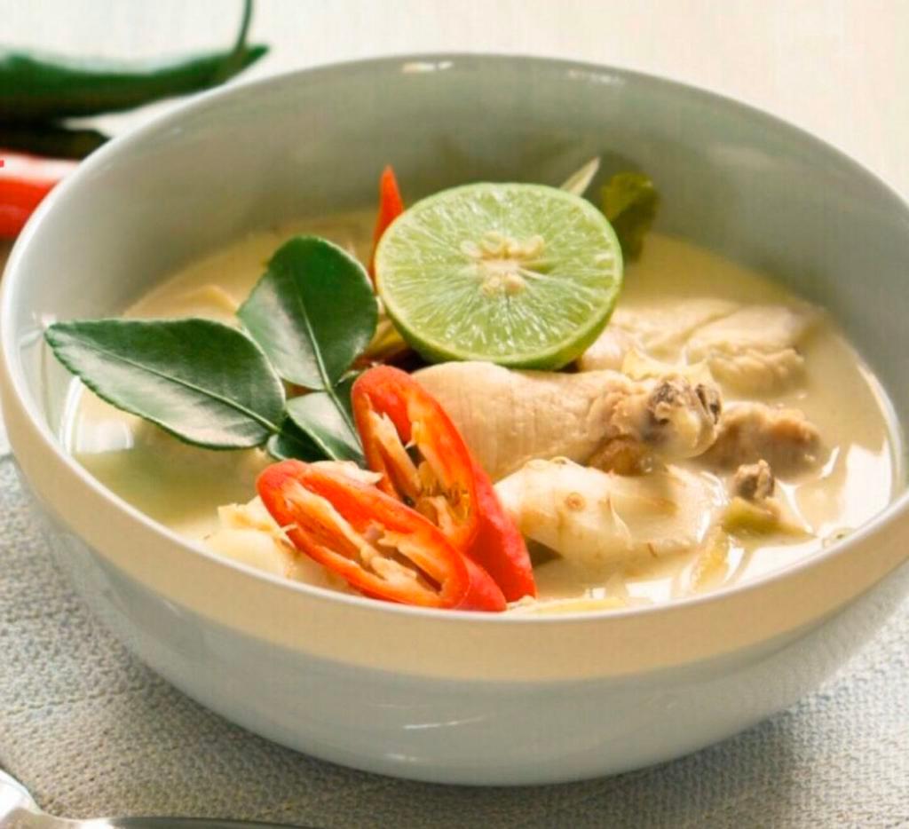 6. Tom Kha · Spicy and sour coconut milk soup with galangal, kaffir lime leaves, lemongrass onion, and cabbage.