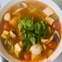 5. Tom Yum · Spicy and sour lemon grass soup with galangal, kaffir lime leaves, tomato, onion, and mushro...