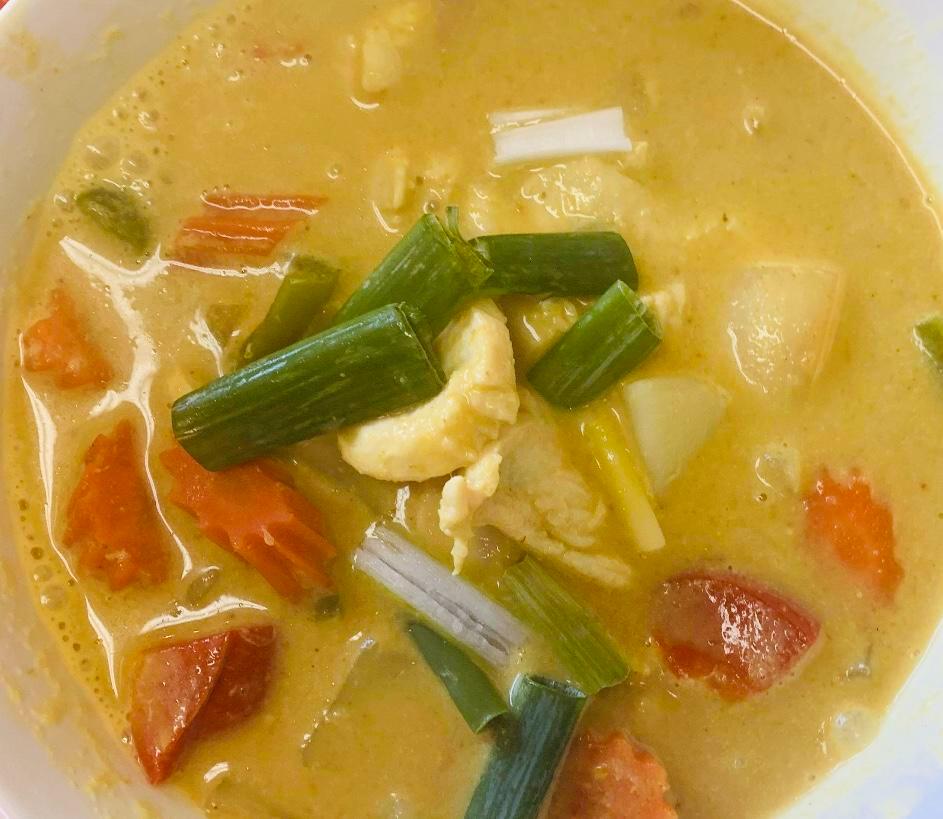 7. Yellow Curry · Potato, carrot, onion and bell pepper in homemade Thai yellow curry sauce with a side of rice.