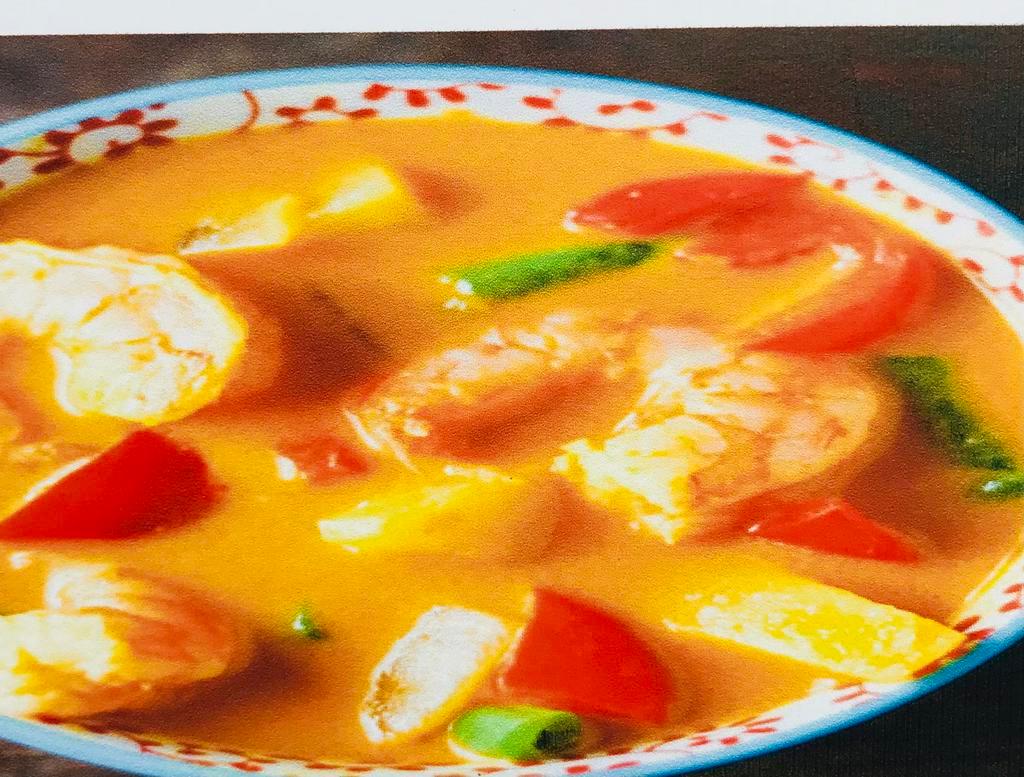Penang Curry · Red curry cooked incoconut milk with bell pepper ,green bean ,Mushroom,Kaffir lime leaves&Basil leaves . 