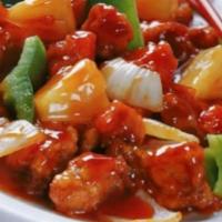 Sweet and Sour · Pineapple stir-fried in sweet and sour sauce with pepper, cucumber, tomato, and onion.
